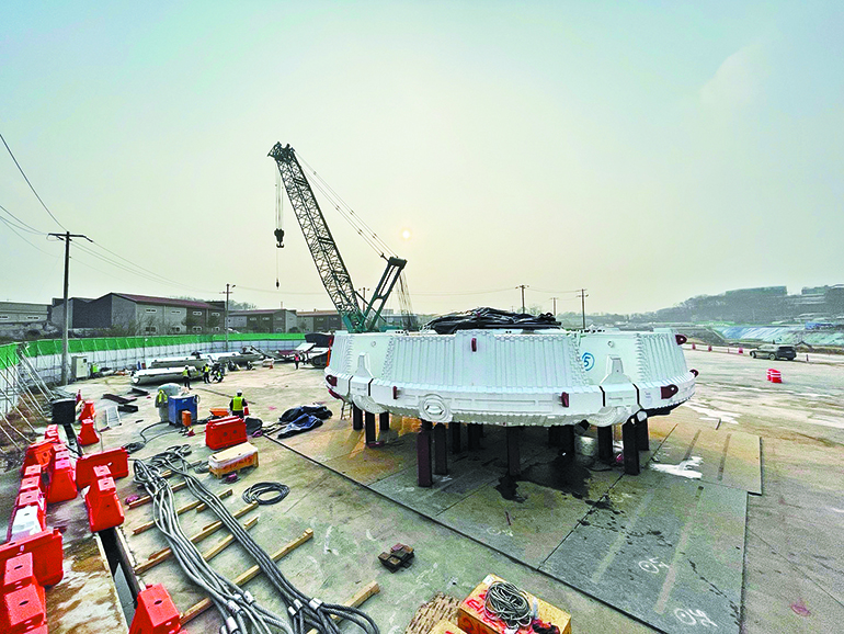 TBM production site. Huge TBM with a diameter of 14 meters, an overall length of 125 meters, and a total weight of 3,200 tons is used for tunnel construction at the section 2 of the construction site  of Gimpo-Paju National Road 400 where the technical demonstration was held. 